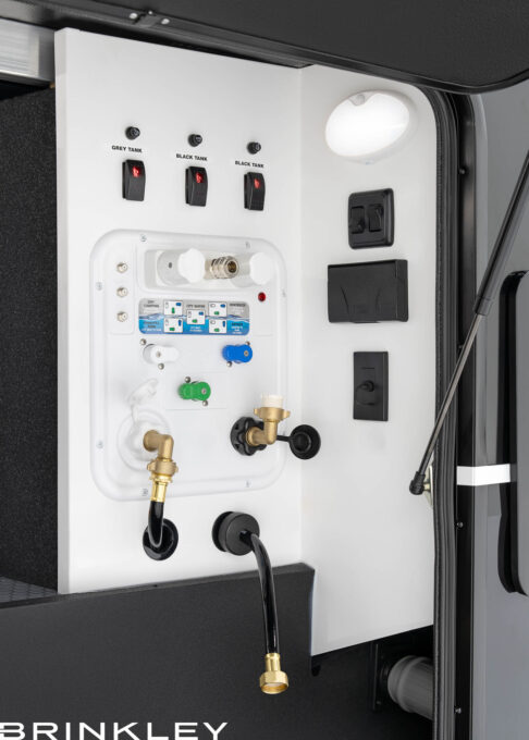 | Model Gx Toy Hauler Line 61 Fifth Wheel Toy Hauler Docking Utility Center with Electric Dump Valves & Retractable 65' Water Hose.