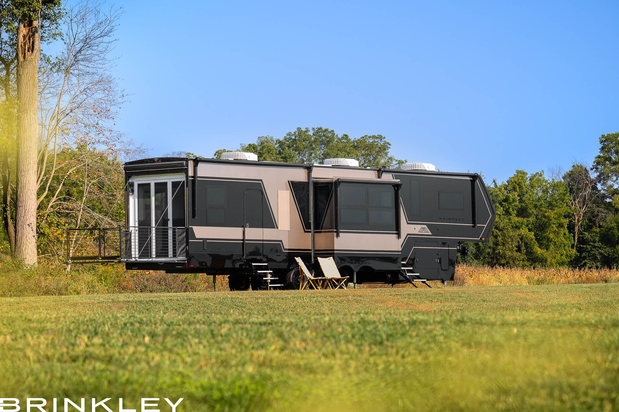| Model G Fifth Wheel Toy Hauler Line 117 Brinkley Model G Luxury Fifth Wheel Toy Hauler in Premium Exterior with Premium Exterior w/ Gold & Black Paint