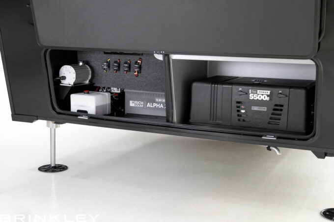 | Model Gx Toy Hauler Line 65 Brinkley RV Model Gx fifth wheel toy hauler's basement storage and energy system featuring a FlexPower 5500 EFI generator and 200 Ah lithium battery bank.